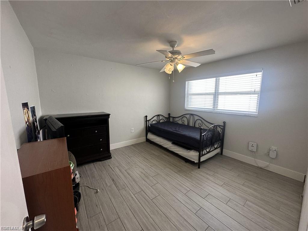 Bedroom featuring light wood-type flooring and ceiling fan