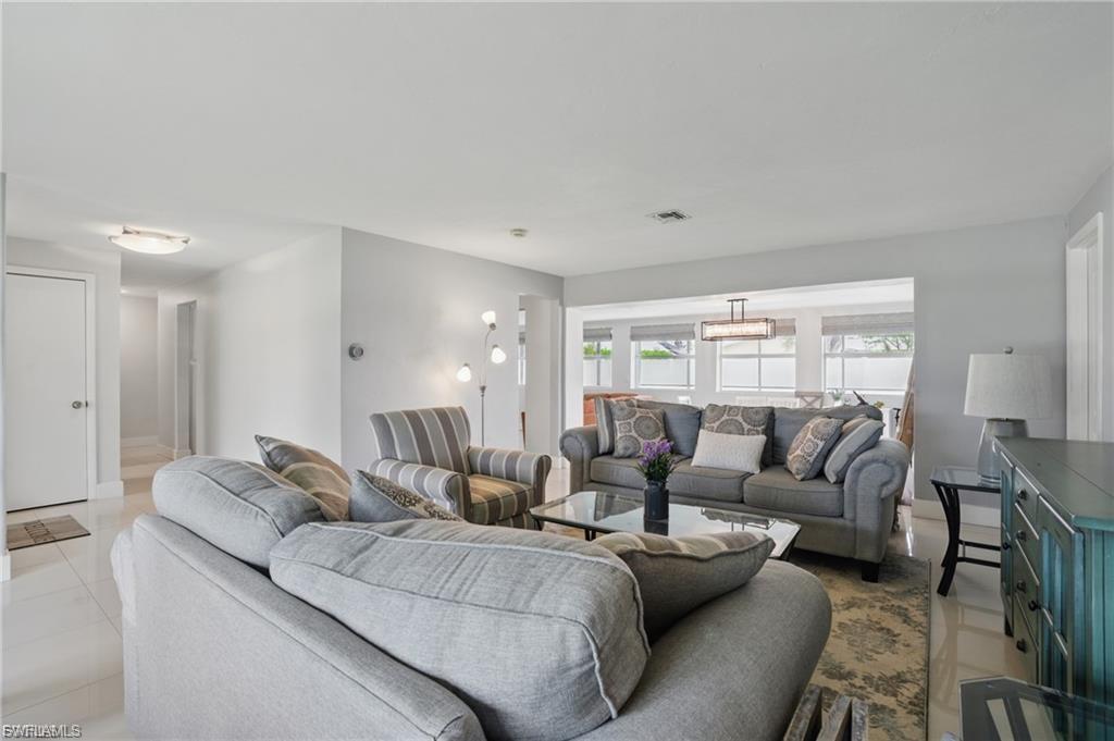 Living room with light tile patterned floors