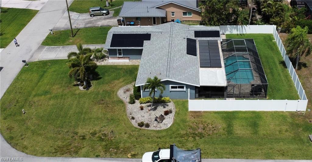 View of subject property featuring a pool