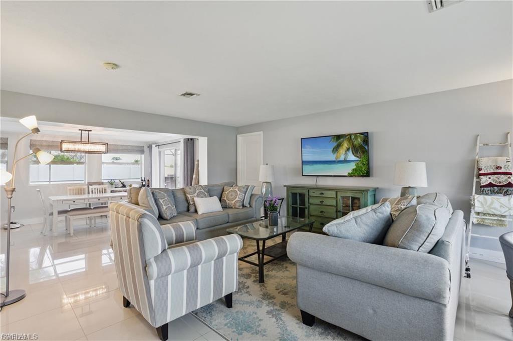 Living area with light tile patterned floors