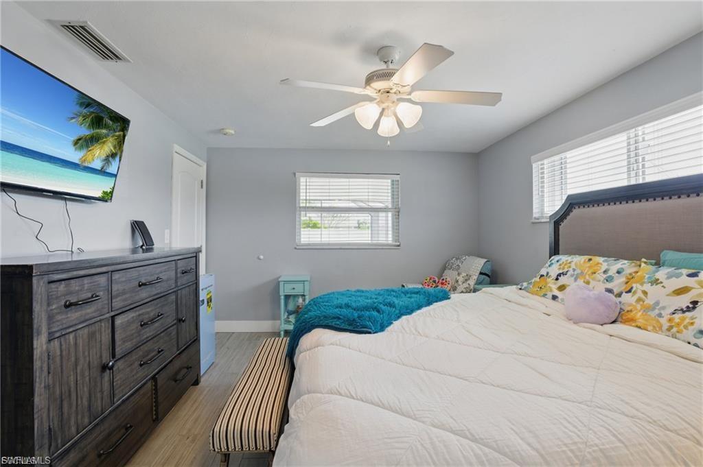 Bedroom featuring light wood-type flooring and ceiling fan