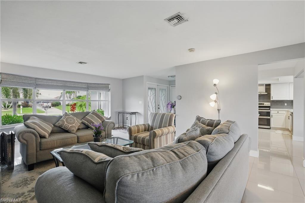 Living room with light tile patterned floors