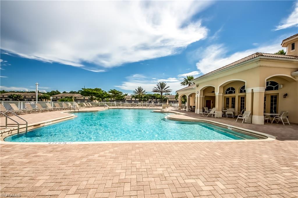 Community pool featuring a patio