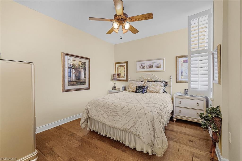 Bedroom with wood-type flooring and ceiling fan