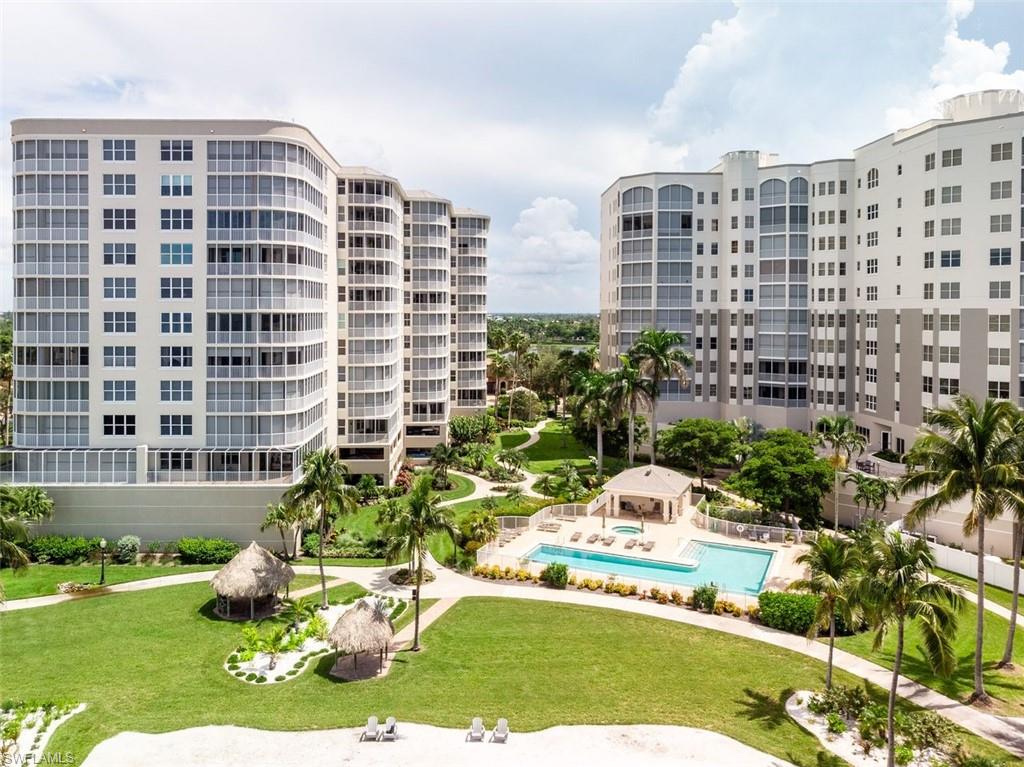 View of apartment building / complex featuring a community pool