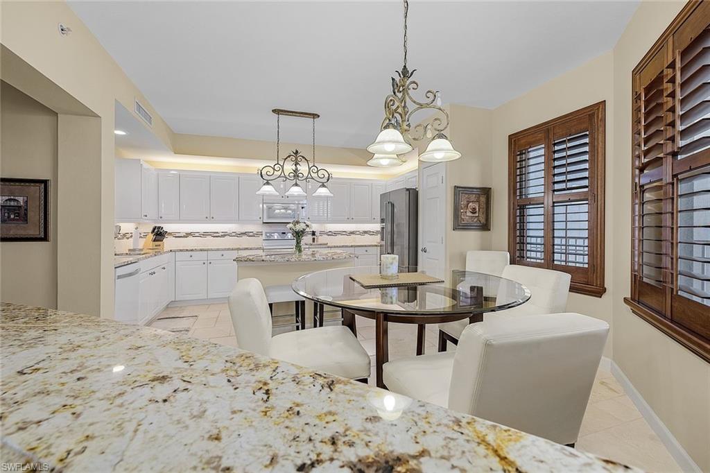 Dining room featuring a chandelier and light tile patterned floors