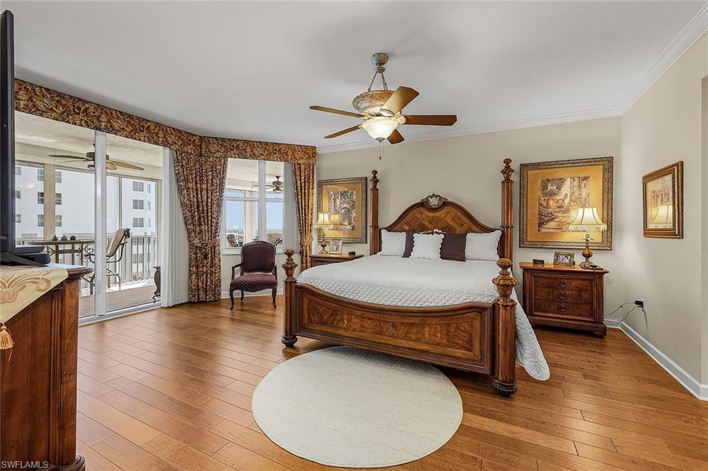Bedroom with access to exterior, ornamental molding, hardwood / wood-style flooring, and ceiling fan
