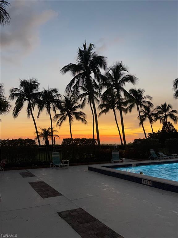Pool at dusk with a community pool