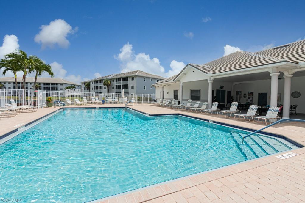 Community pool with a patio