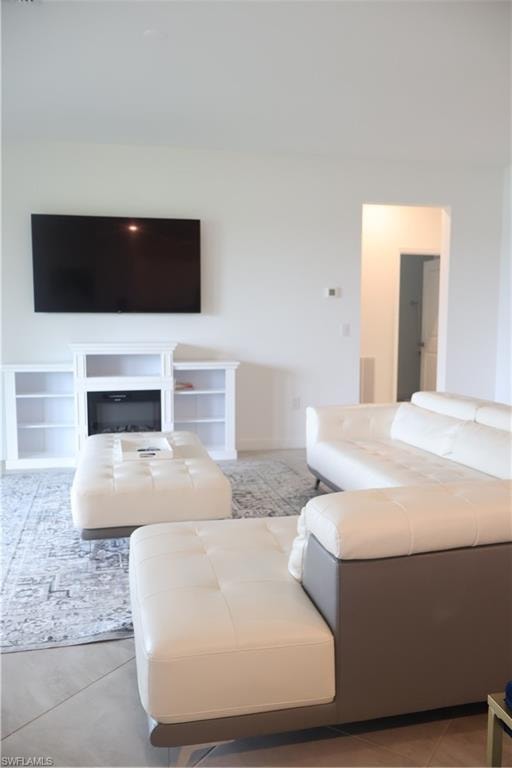 Living room featuring light tile patterned floors