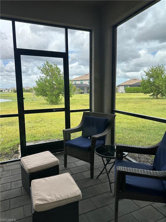 First floor lanai with an seating hangout area