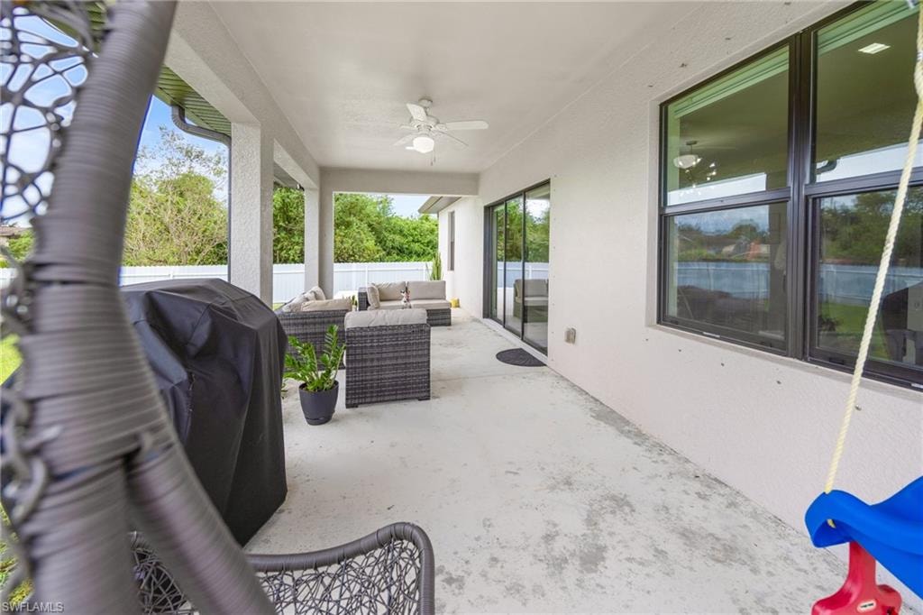 View of patio / terrace featuring an outdoor hangout area, a ceiling fan, and a grill