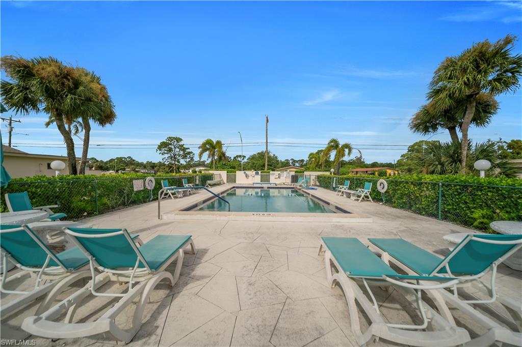 Community pool with a patio