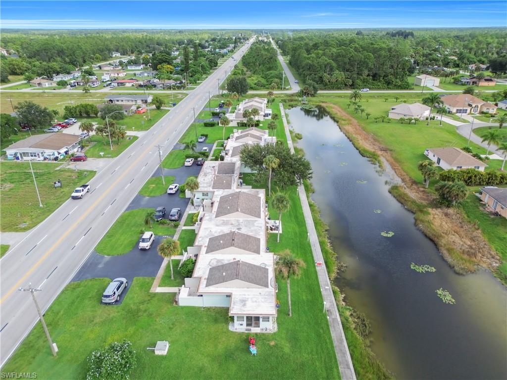 Aerial view of property's location with nearby suburban area and a large body of water