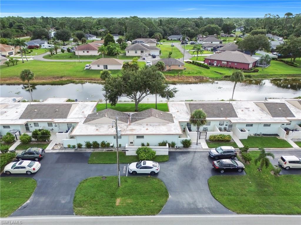 Aerial perspective of suburban area with a nearby body of water