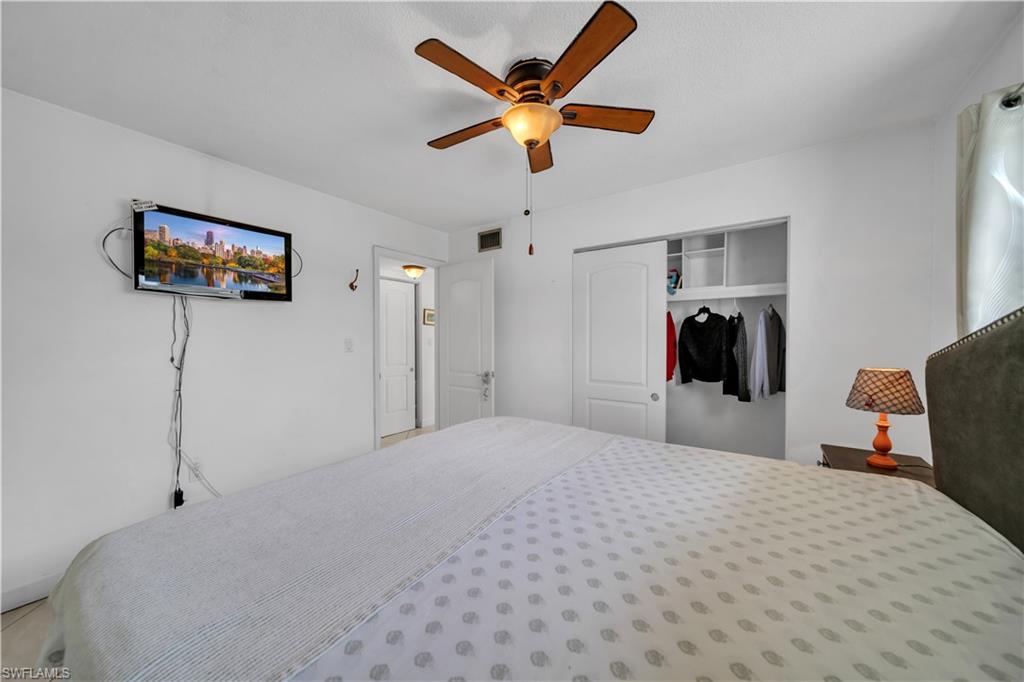 Bedroom with a closet and a ceiling fan