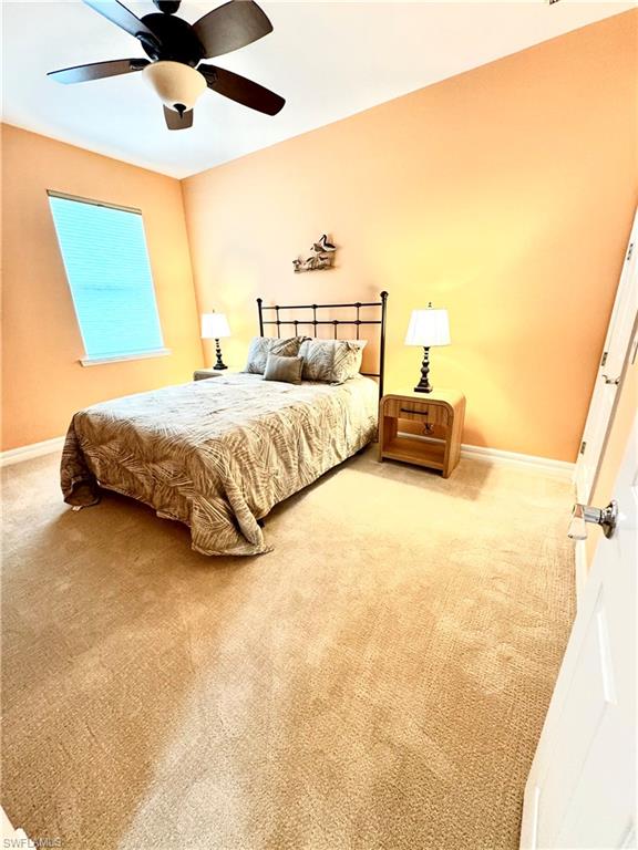 Bedroom with carpet flooring and a ceiling fan