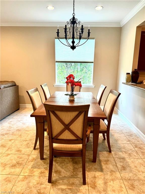 Dining room featuring ornamental molding, light tile patterned flooring, and a chandelier
