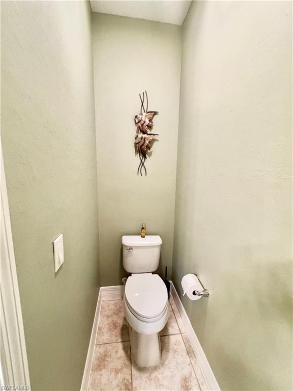 Bathroom featuring toilet and tile patterned floors