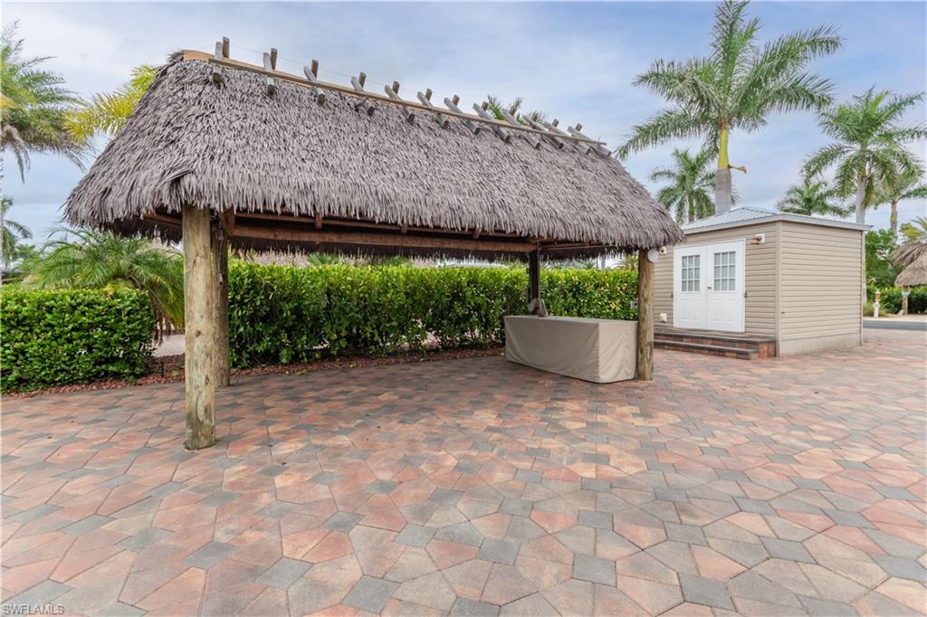 View of patio / terrace with a gazebo and an outbuilding