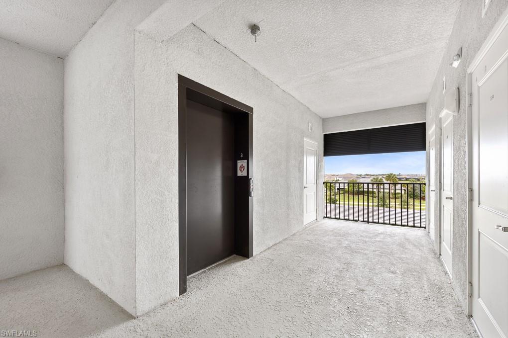 Corridor featuring elevator