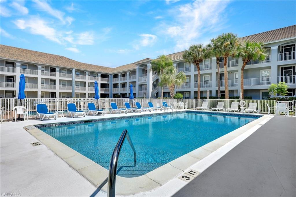 Community pool featuring a patio area