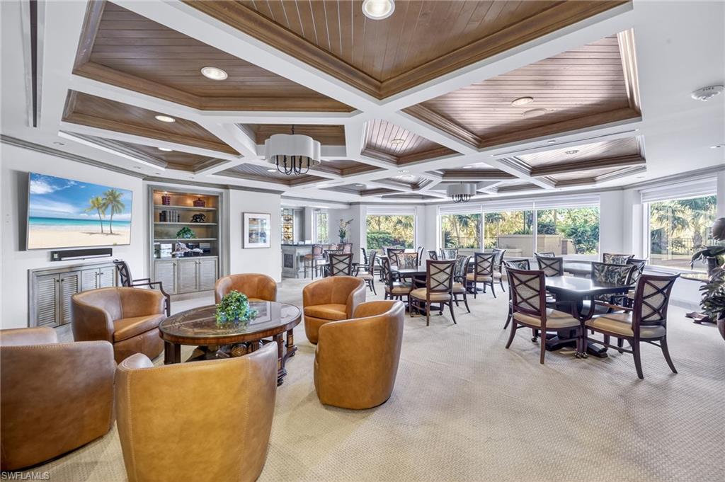 Social Room featuring crown molding, coffered ceiling, and a wooden ceiling with exposed beams