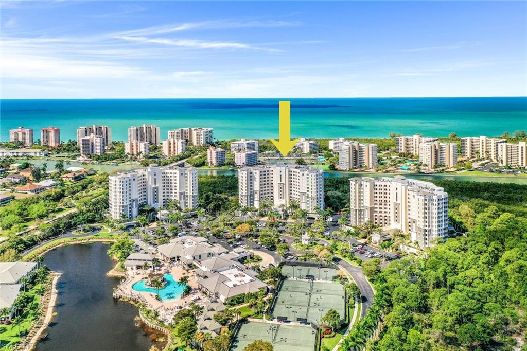 View of urban area featuring a large body of water and a pool area