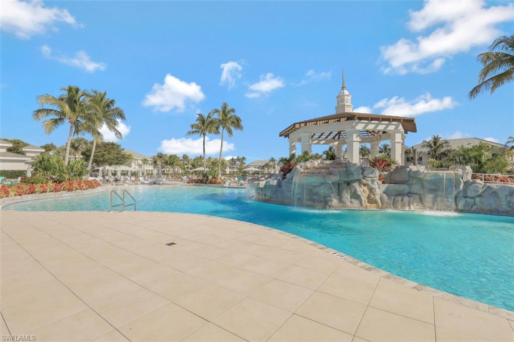 Community pool featuring a patio