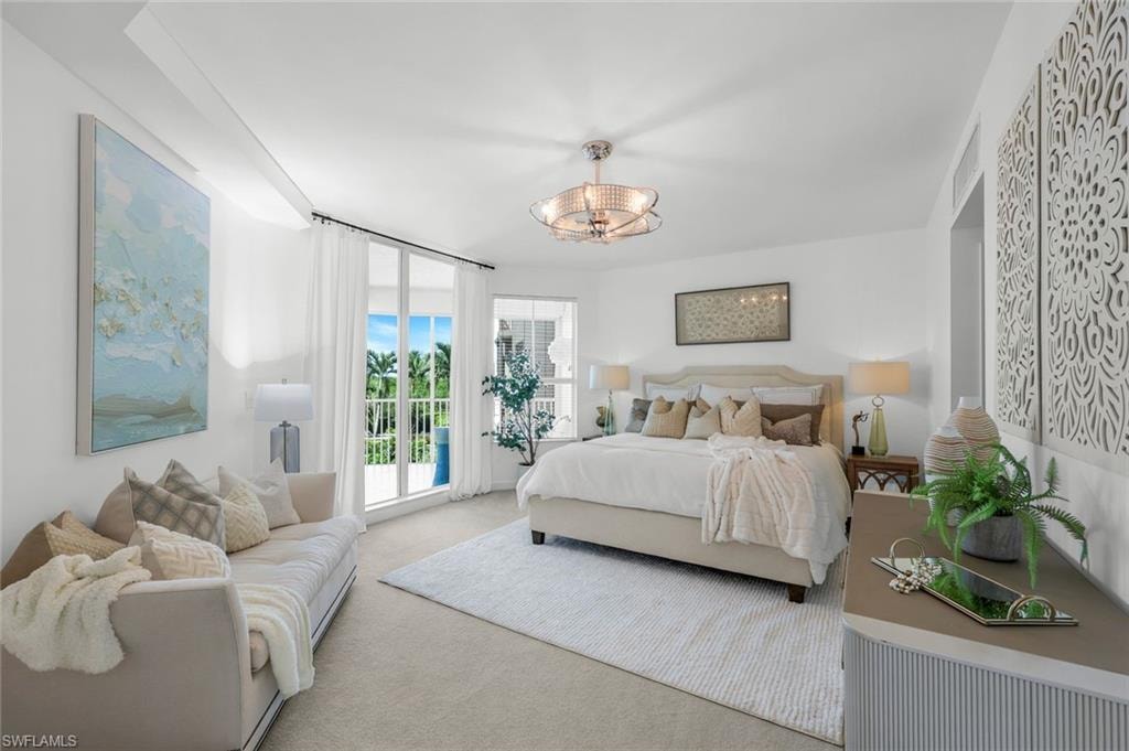 Bedroom featuring carpet floors and access to exterior