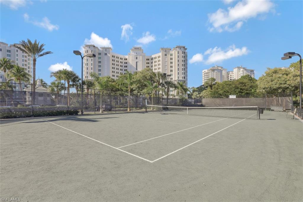 View of tennis court featuring community basketball court