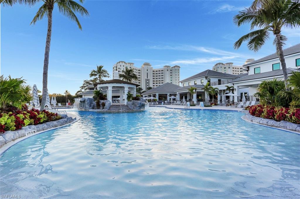 Community pool with a patio