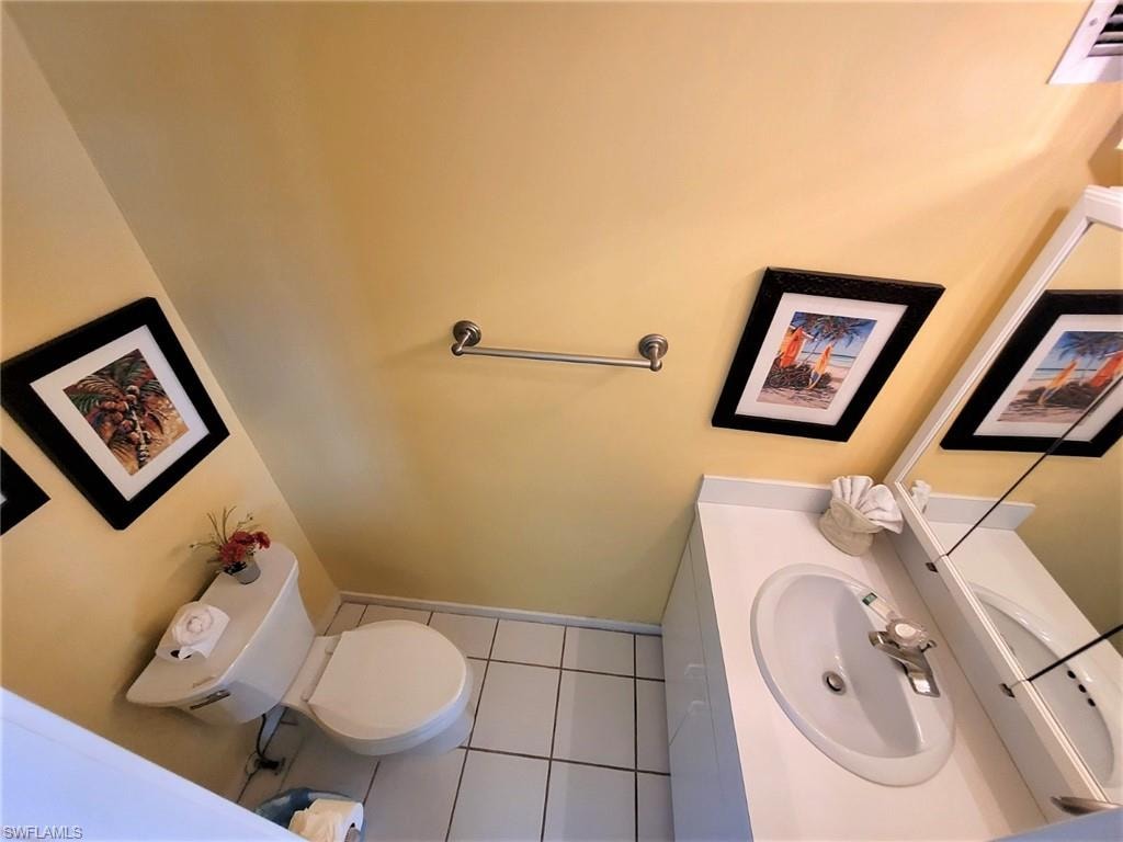 Bathroom featuring vanity and tile patterned flooring