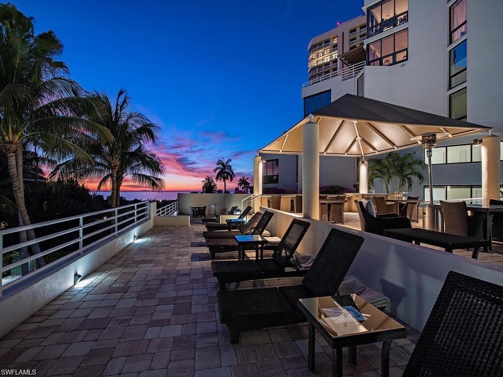 View of patio / terrace featuring an outdoor hangout area and an outdoor kitchen