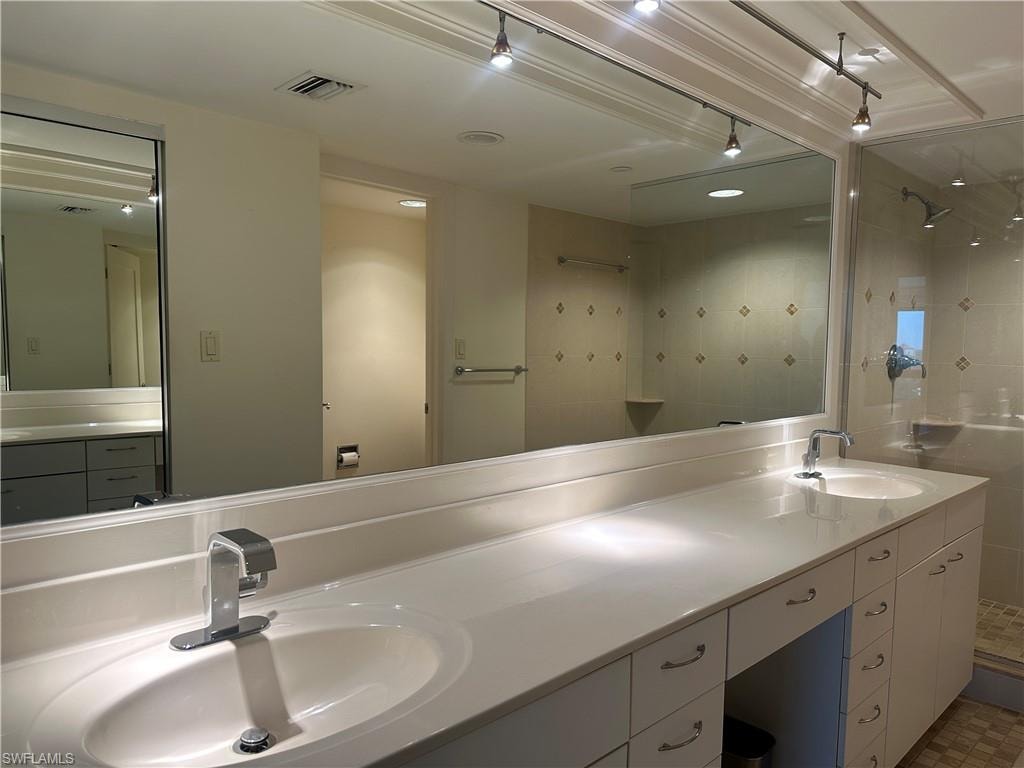 Bathroom with a walk in shower and double vanity