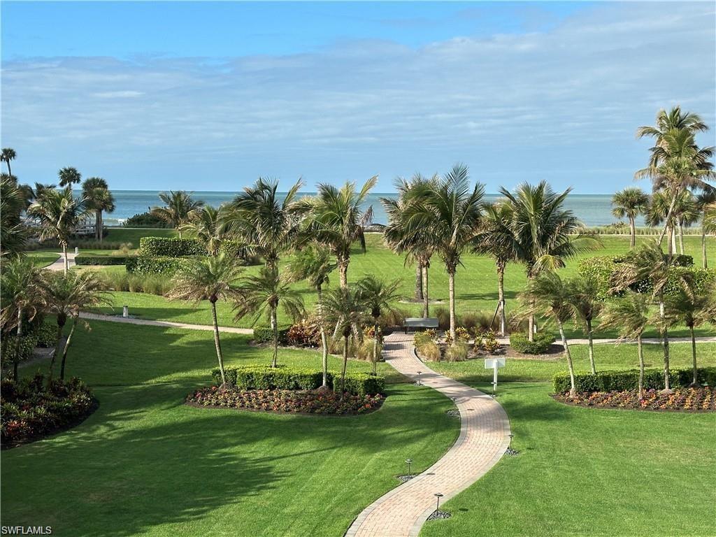 View of community with a water view and a yard
