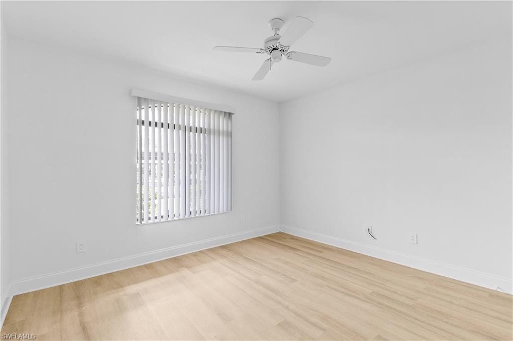 Spare room featuring light wood finished floors and a ceiling fan