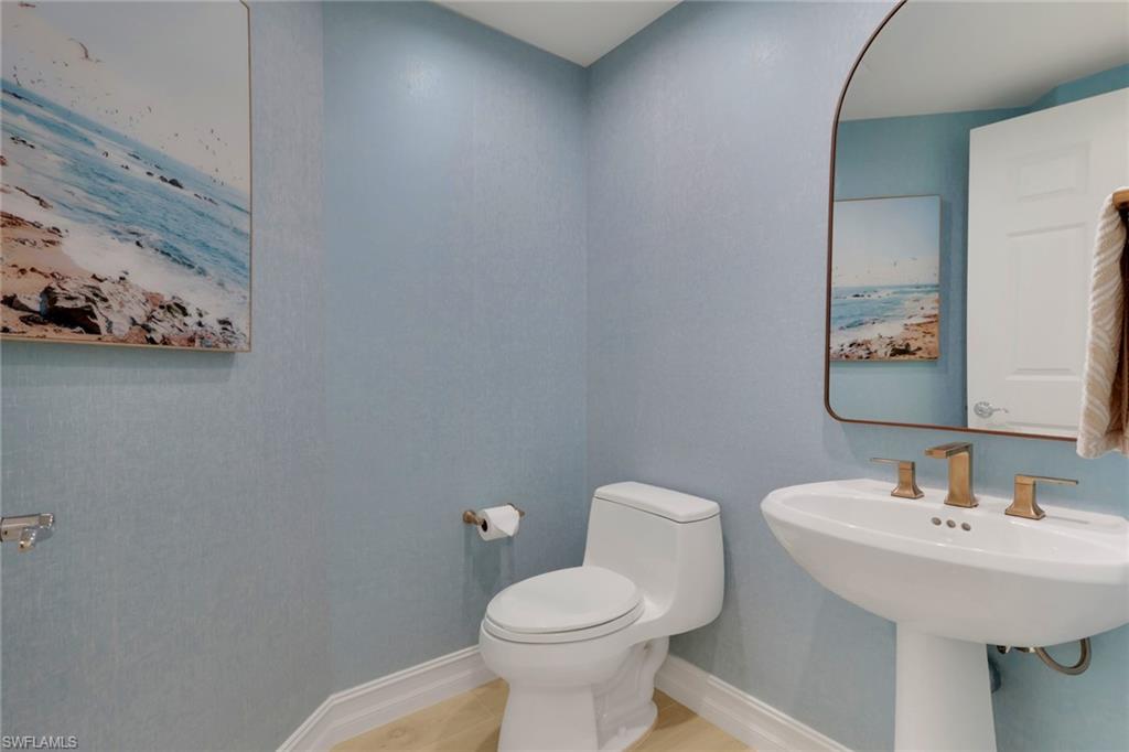 Bathroom with toilet and tile patterned floors