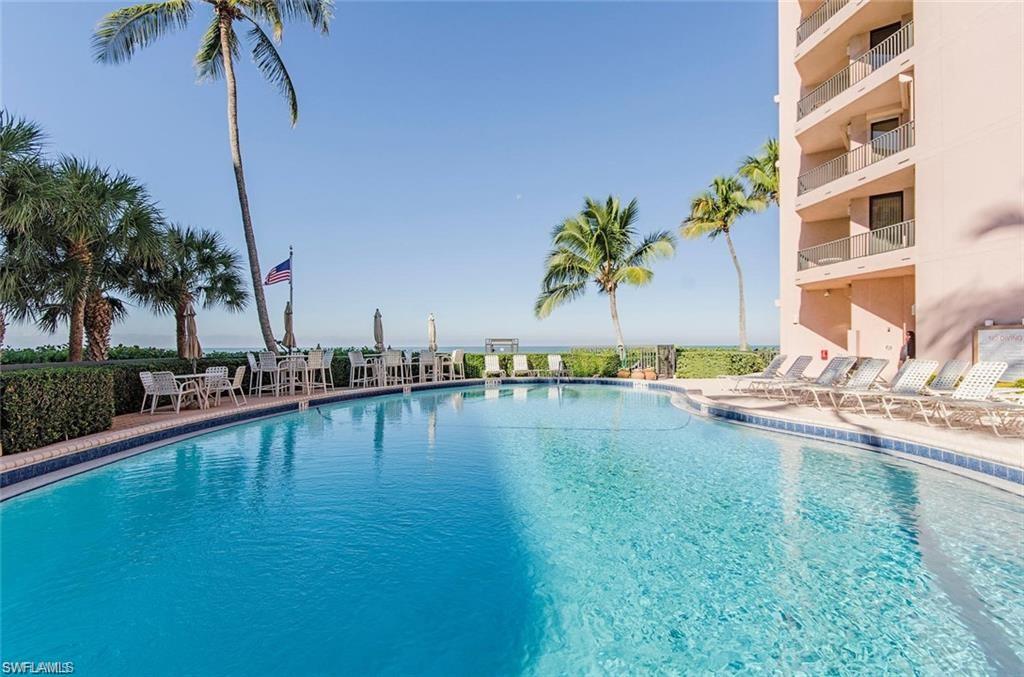 Community pool featuring a patio