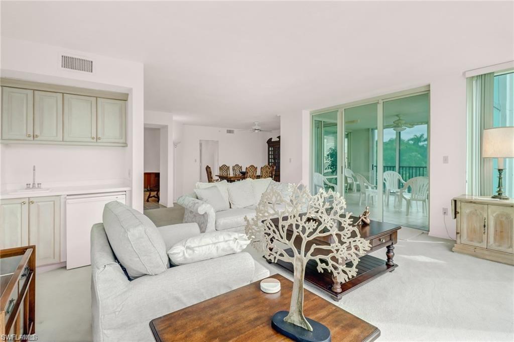 Living area with light carpet