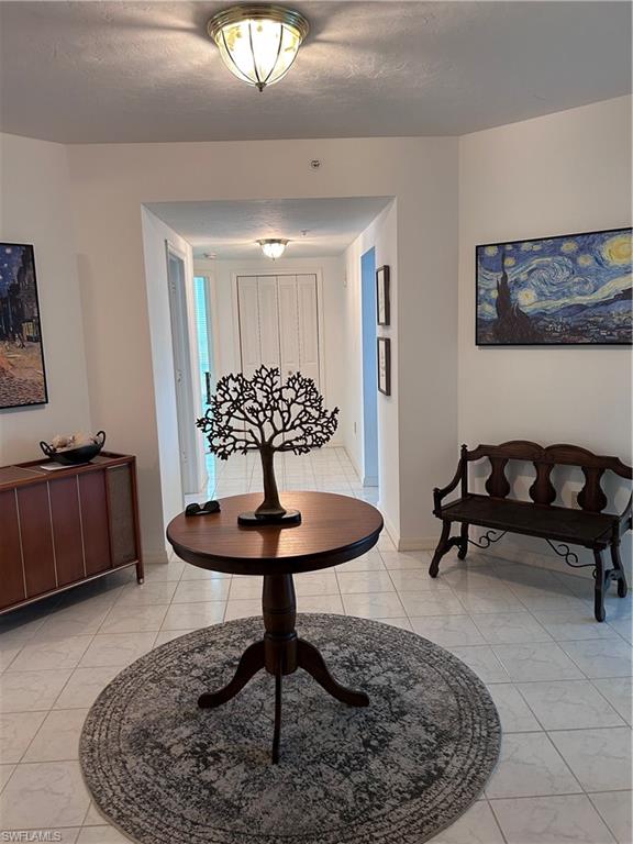 Entryway featuring a textured ceiling