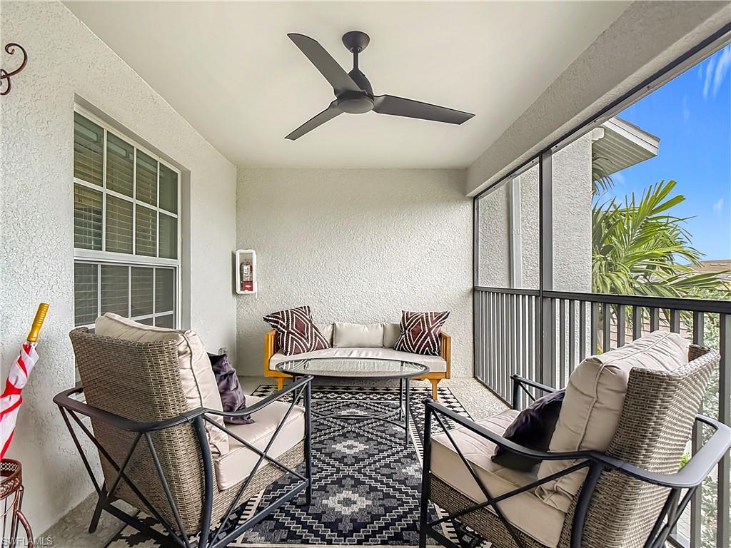 Balcony featuring ceiling fan and an outdoor living space