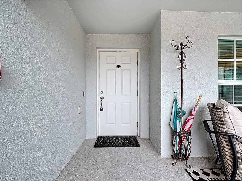View of exterior entry featuring stucco siding