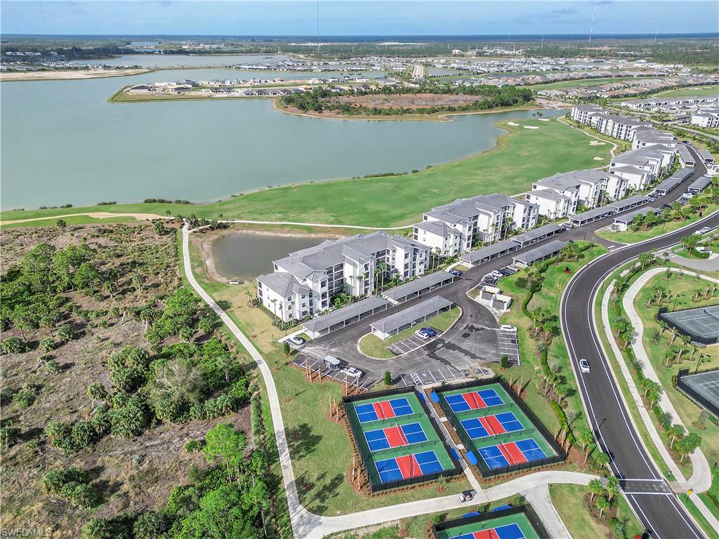 Drone / aerial view of a large body of water and a local golf course