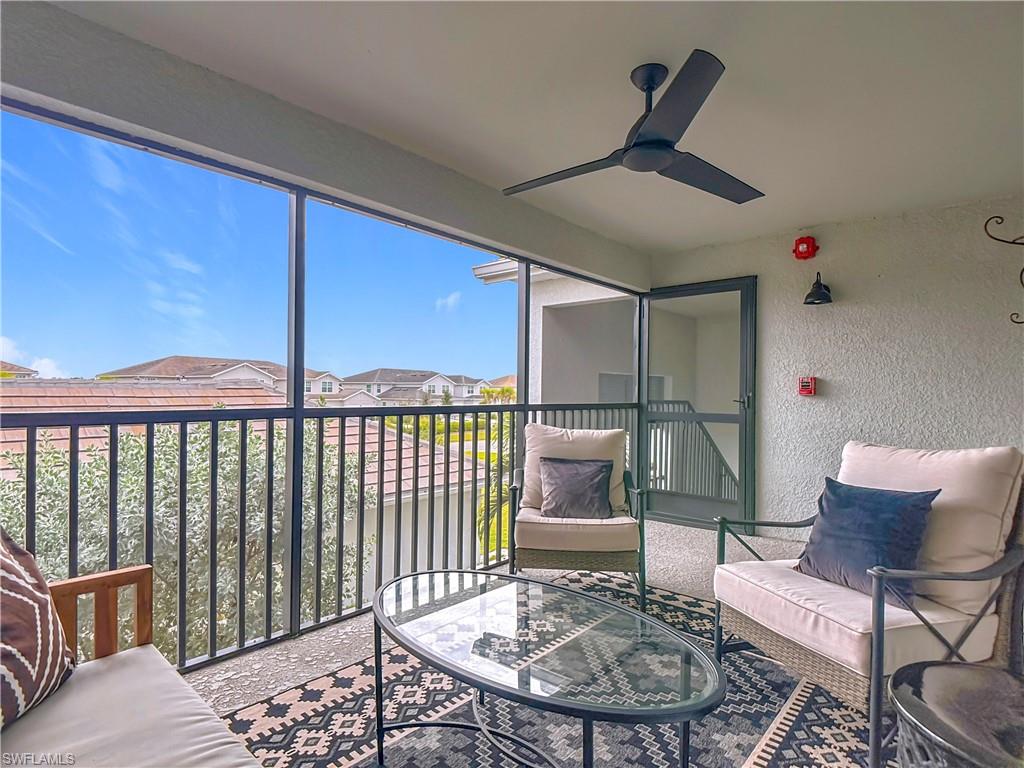 Sunroom featuring a residential view