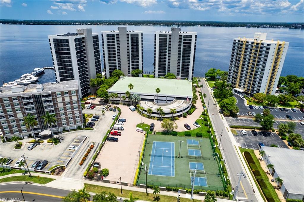 Bird's eye view of apartment complex and a large body of water