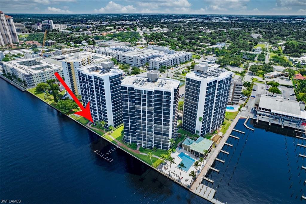 View of urban area featuring a pool and a nearby body of water