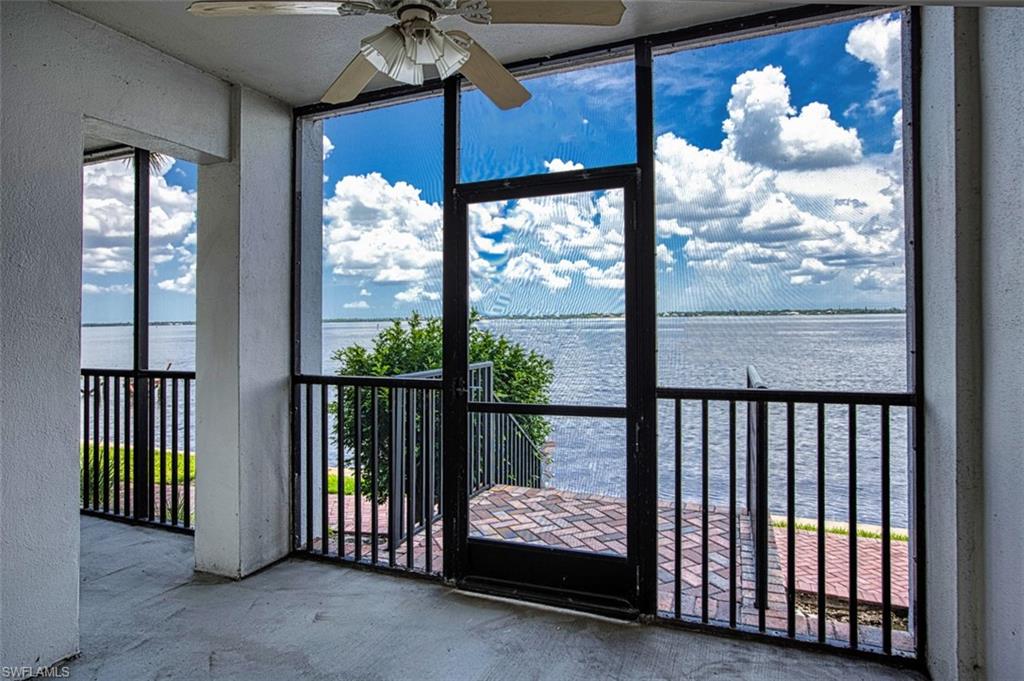Lanai featuring a water view and healthy amount of natural light