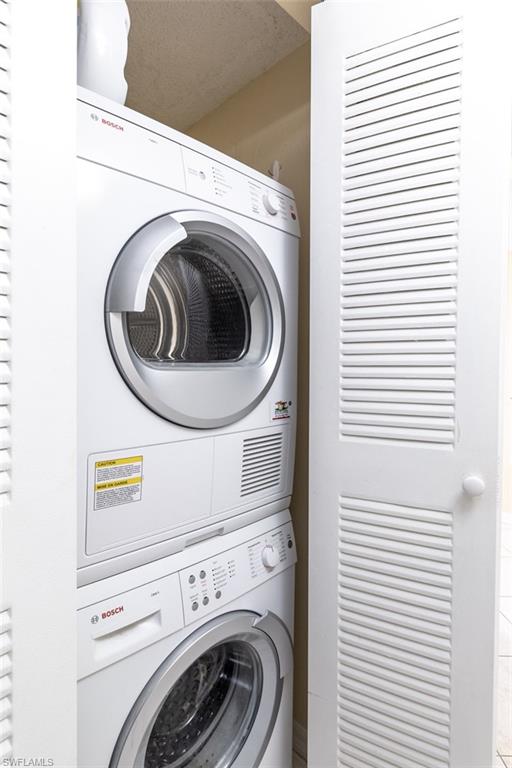 Laundry area with stacked washer / dryer