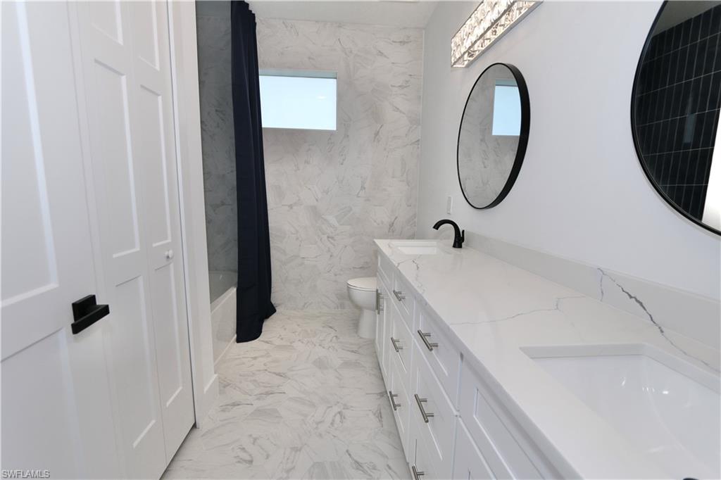 2nd Bathroom featuring shower / bath combination with curtain